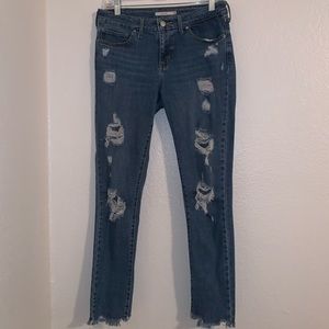 Levi’s distressed skinny jeans with frayed ankle